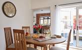 A lovely setting to gather round and enjoy supper in the beautifully decorated dining-room. - Thumbnail Image