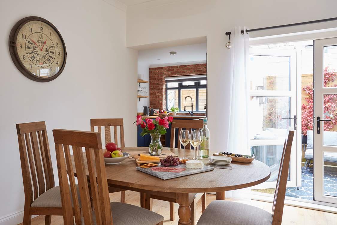 A lovely setting to gather round and enjoy supper in the beautifully decorated dining-room.