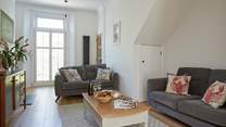 The modern living-room with comfortable seating-area.