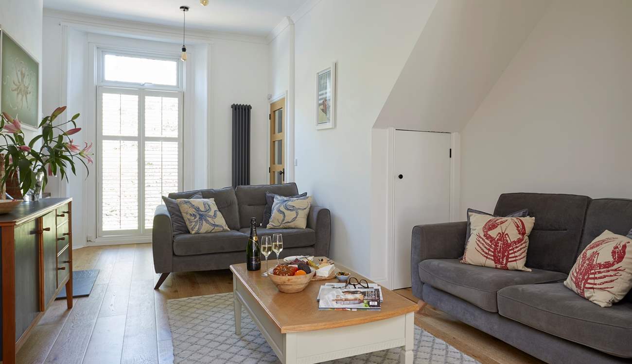 The modern living-room with comfortable seating-area.