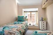 The second bedroom can be set up as twin beds or a king-size bed.