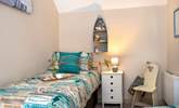 The second bedroom has a seaside theme embracing the setting. - Thumbnail Image