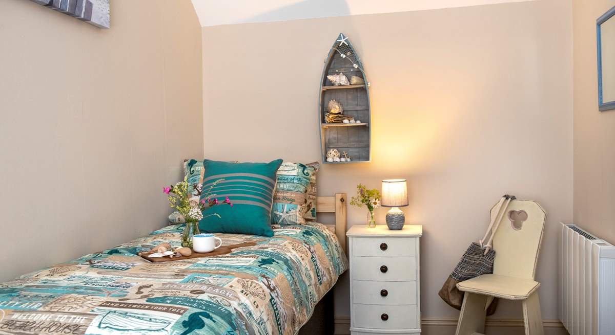 The second bedroom has a seaside theme embracing the setting.