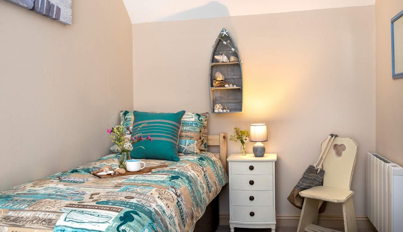 The second bedroom has a seaside theme embracing the setting.