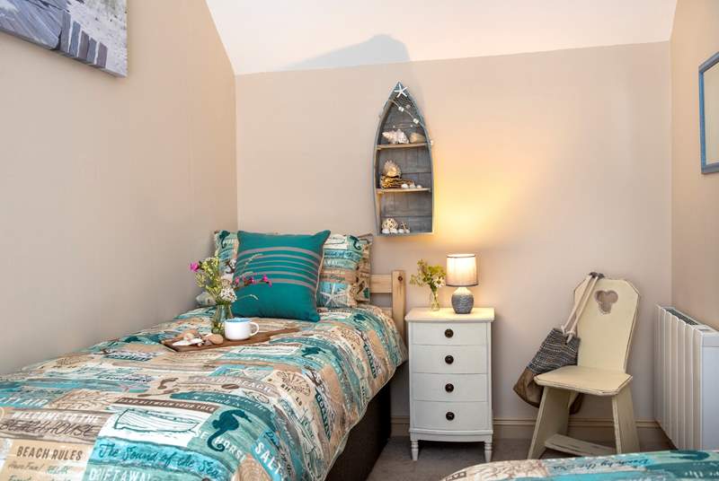 The second bedroom has a seaside theme embracing the setting.