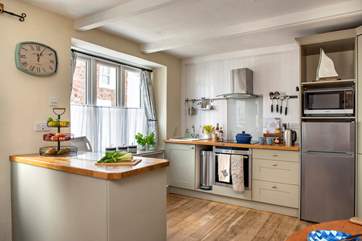 The cottage kitchen is quite charming.