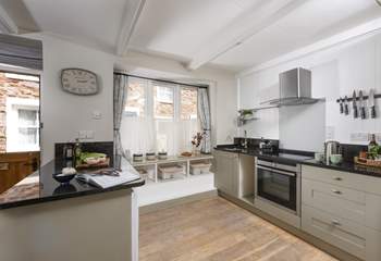 The cottage is kitchen is quite charming.