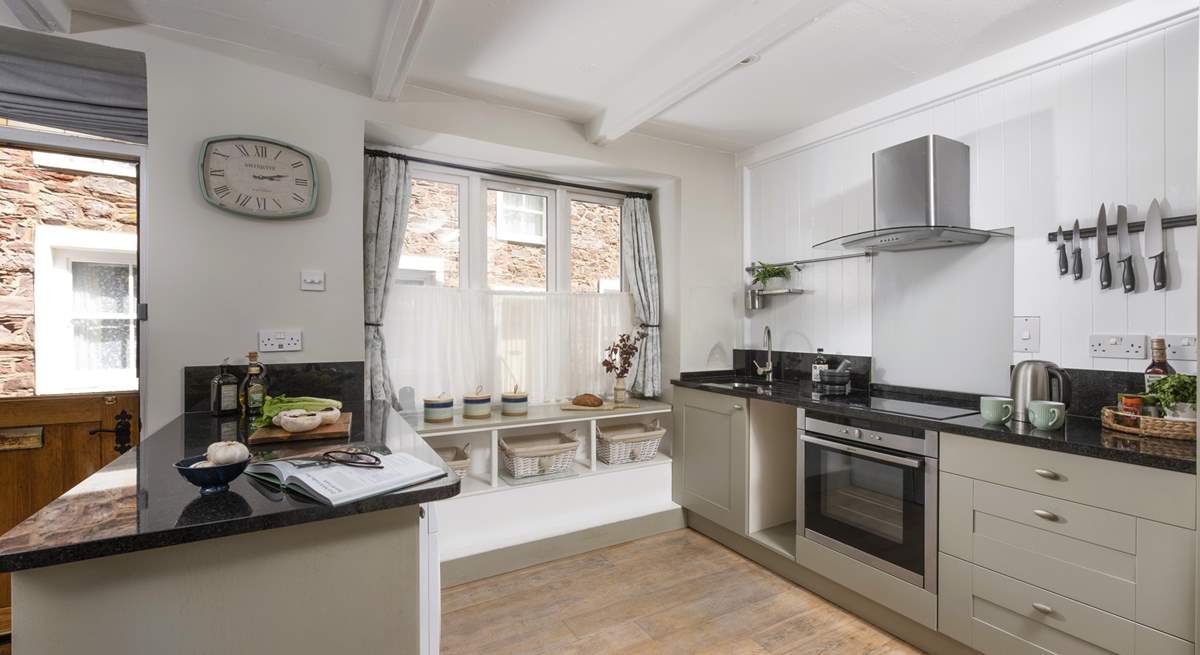 The cottage is kitchen is quite charming.
