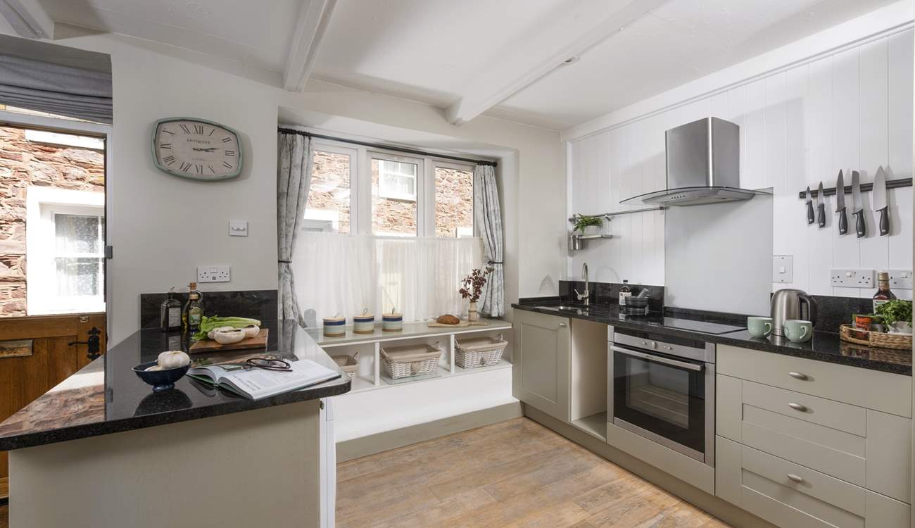 The cottage is kitchen is quite charming.