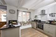 The cottage is kitchen is quite charming.