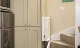 The stairs lead up from the kitchen area. - Thumbnail Image