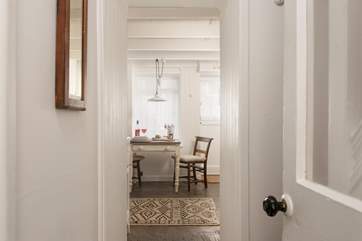 The sitting-room, with a little step, leads through to the kitchen and dining space.