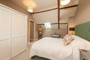Plenty of room for your holiday clothes. The door leads through to a utility/laundry room.
