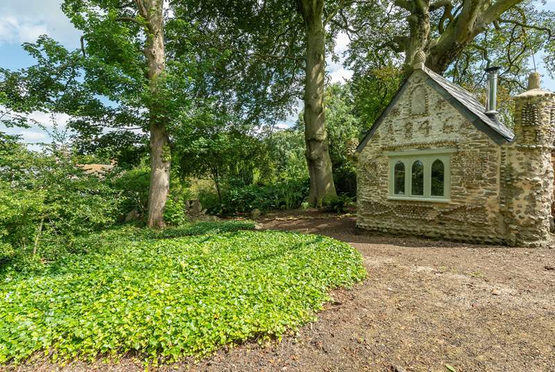 In the grounds there is a sweet Gothic folly decorated with pebbles from Chesil Beach.