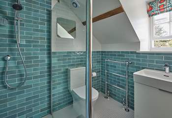 This stylish shower-room has an invigorating rainfall shower.