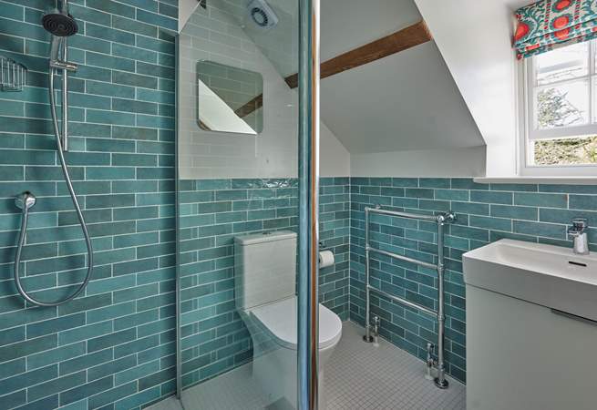 This stylish shower-room has an invigorating rainfall shower.