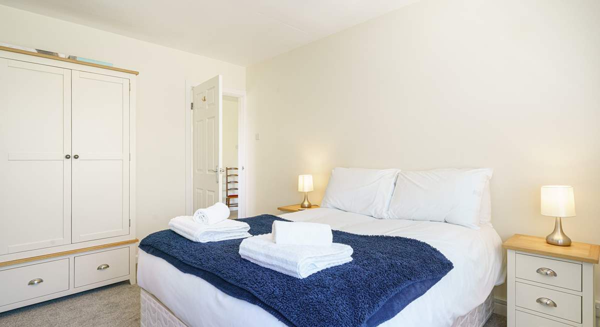 Bedroom 2 on the ground floor, next to the family bathroom with a TV. 