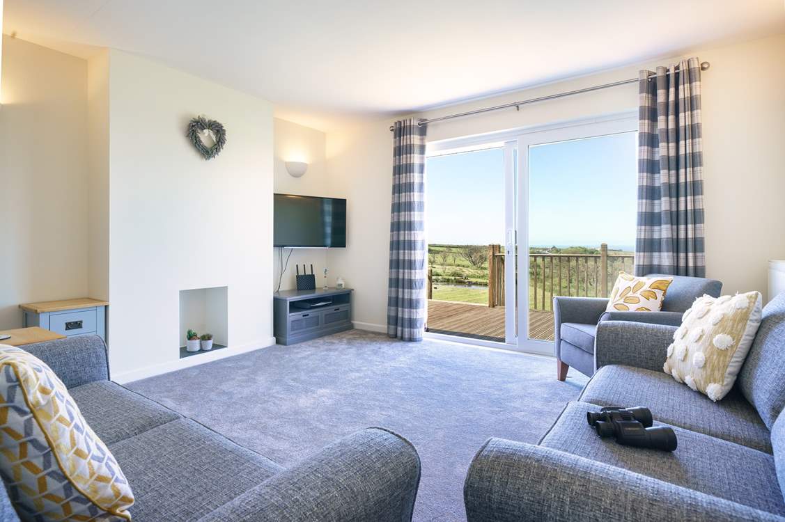 Stylish lounge to relax in with access to the decking and those splendid views.
(furniture has been updated to a large, very comfortable corner sofa)