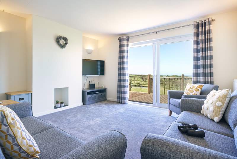 Stylish lounge to relax in with access to the decking and those splendid views.