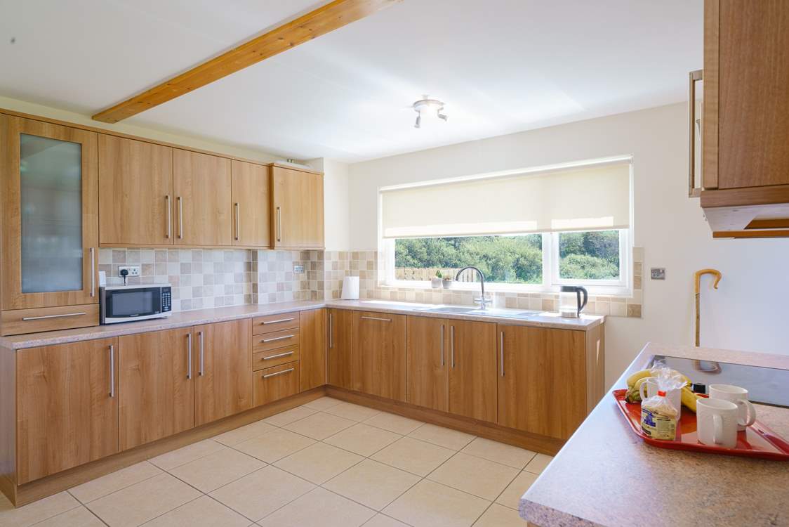 Spacious, airy kitchen. with rural and sea views.