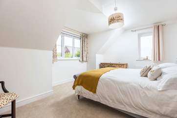Bedroom two is spacious with a lovely dressing table.