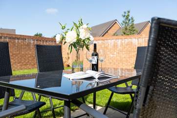 The fully enclosed garden is perfect for a spot of al fresco dining.