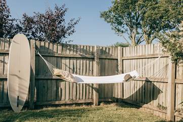 Outside you'll find a very sunny patio area complete with a table and chairs if you fancy a spot of al fresco dining - and a hammock to unwind in.
