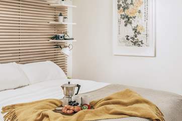 Sleeping will come easy to you in the downstairs bedroom, where lovely linens and a very comfy double bed await you, perfect for long lazy holiday lie-ins.