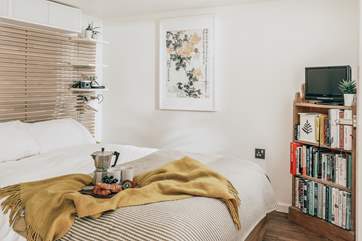 The gorgeous bedroom has a double bed and is perfect for breakfast in bed.
