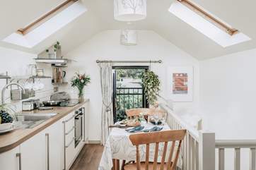 Light pours in from the skylights over the work areas and you can choose to eat at the dining-table, or weather permitting, why not head outside for a meal in your garden.