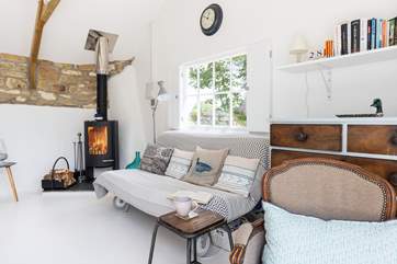 Snuggle up with a good book in front of the wood-burner.