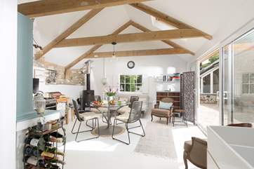 With exposed beams and double height ceiling the living area is light and airy.