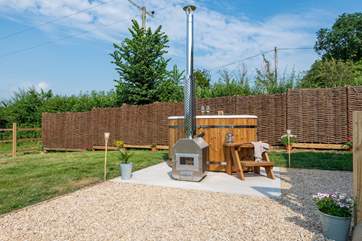 The wood-fired hot tub. Pour yourself a glass of bubbles and hop in.