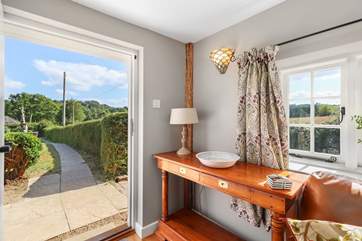 The door from the sitting-room takes you to the garden and patio area.