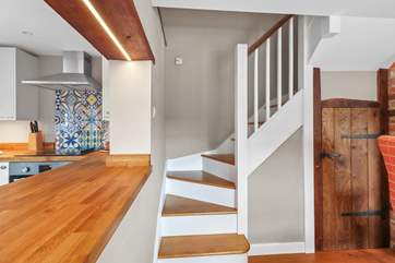 Stairs leading to the bedrooms and bathroom.