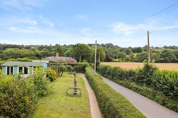The lovely garden with views of the surrounding countryside.
