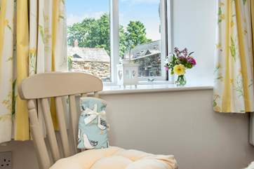 The double bedroom looks out onto the the terrace.