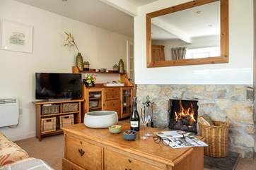 The open plan living-room is bijou but very cosy.
