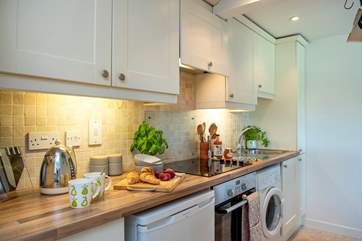 The sweet galley kitchen is surprisingly well-equipped.
