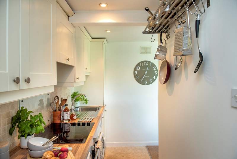 The kitchen is open to the living and dining areas but hidden away so you don't have to look at the dishes!