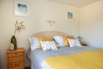 The pretty double bedroom is wonderfully light and airy.
