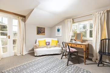 A lovely space in Bedroom one to relax with a good book.