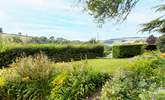 Gorgeous views of the countryside beyond the garden. - Thumbnail Image