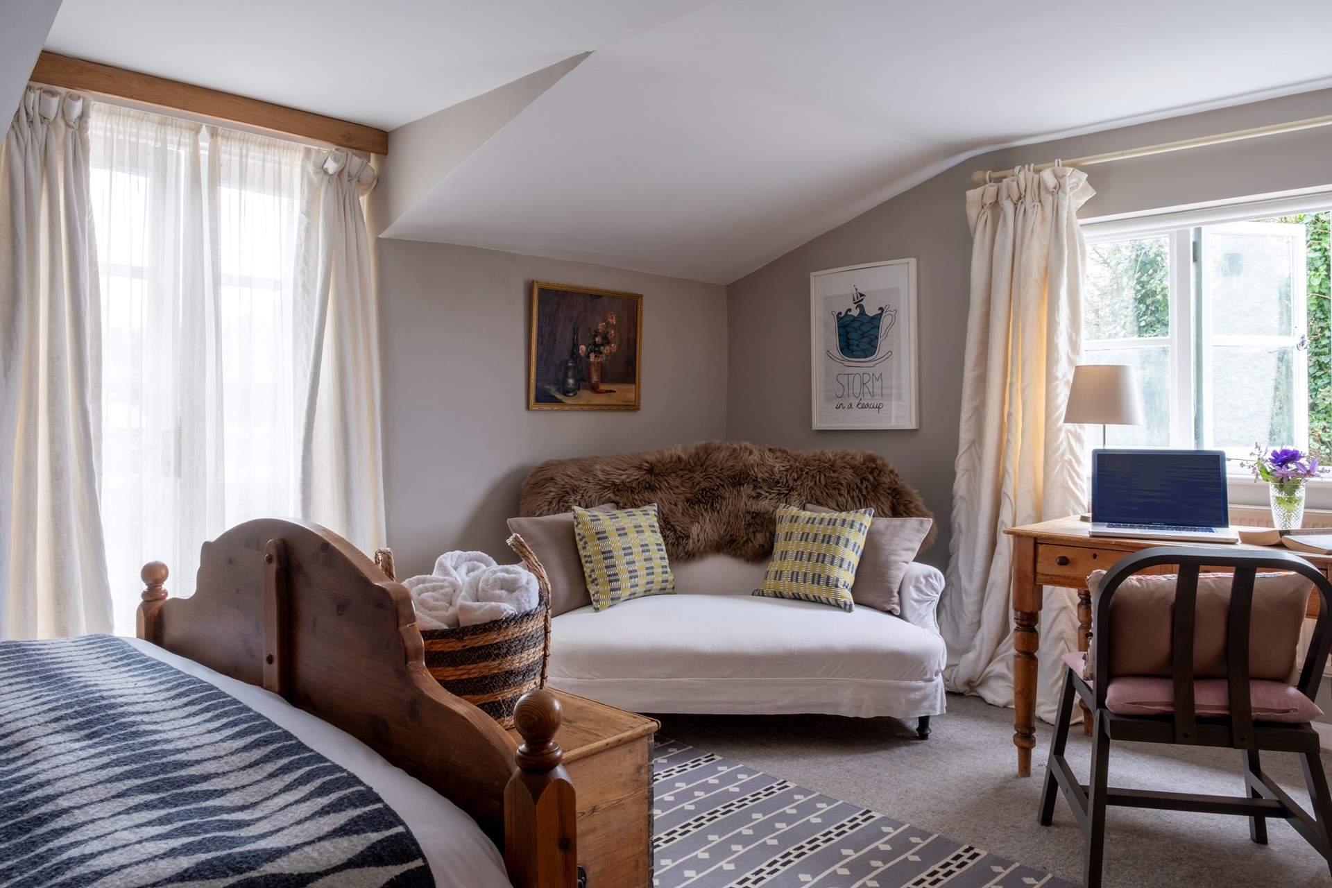 A lovely space in Bedroom one to relax with a good book or catch up with work.