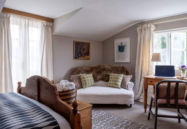 A lovely space in Bedroom one to relax with a good book or catch up with work.