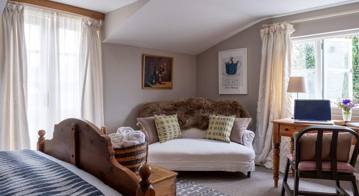 A lovely space in Bedroom one to relax with a good book or catch up with work.