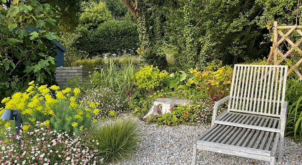 Relax a while in the pretty garden.