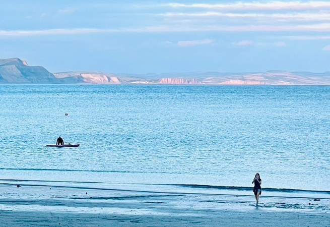 Head to Lyme Bay for a swim or paddle board.