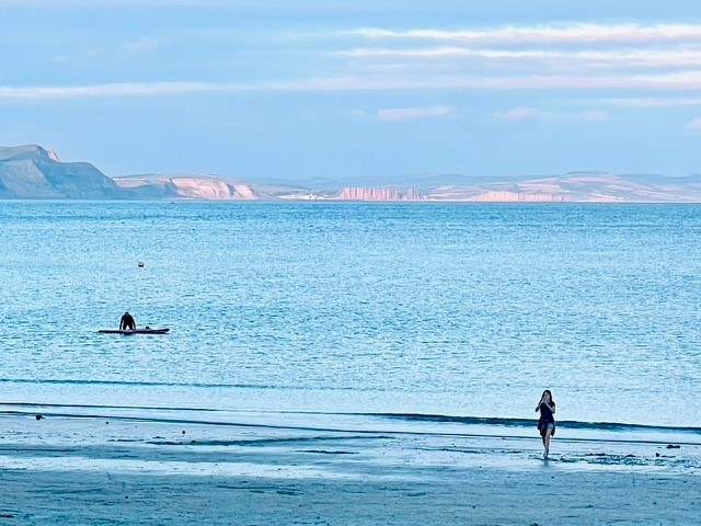 Head to Lyme Bay for a swim or paddle board.