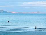Head to Lyme Bay for a swim or paddle board.
